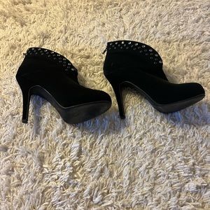 Black embellished suede booties.